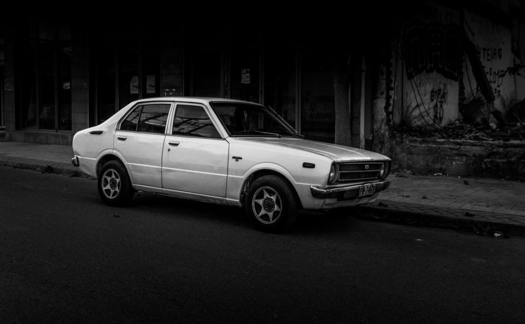 An old car on a city street
